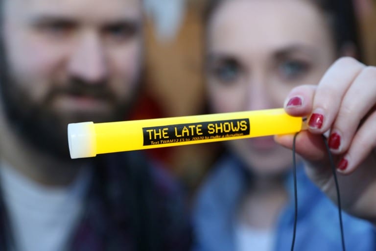 Visitors-hold-up-the-iconic-Late-Shows-glow-stick-during-2015s-event